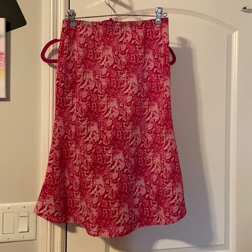 Lucent pink snake print skirt.